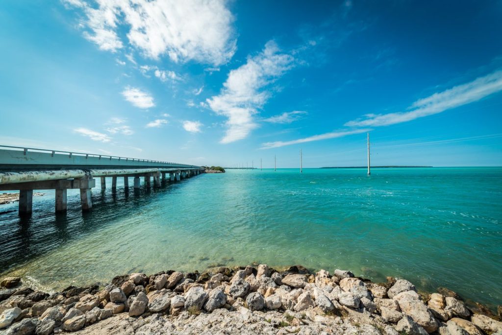 Beautiful ocean view of the Florida Keys with a bridge under a clear blue sky.